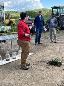 Sauk County Land Conservation staff demonstrating a rainfall simulator 